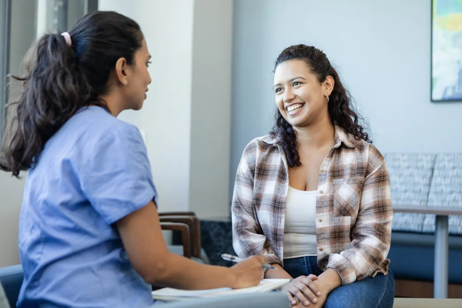 Staff speaking to client about services