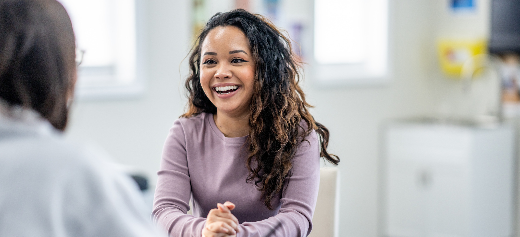 Young woman talking to a health care provider