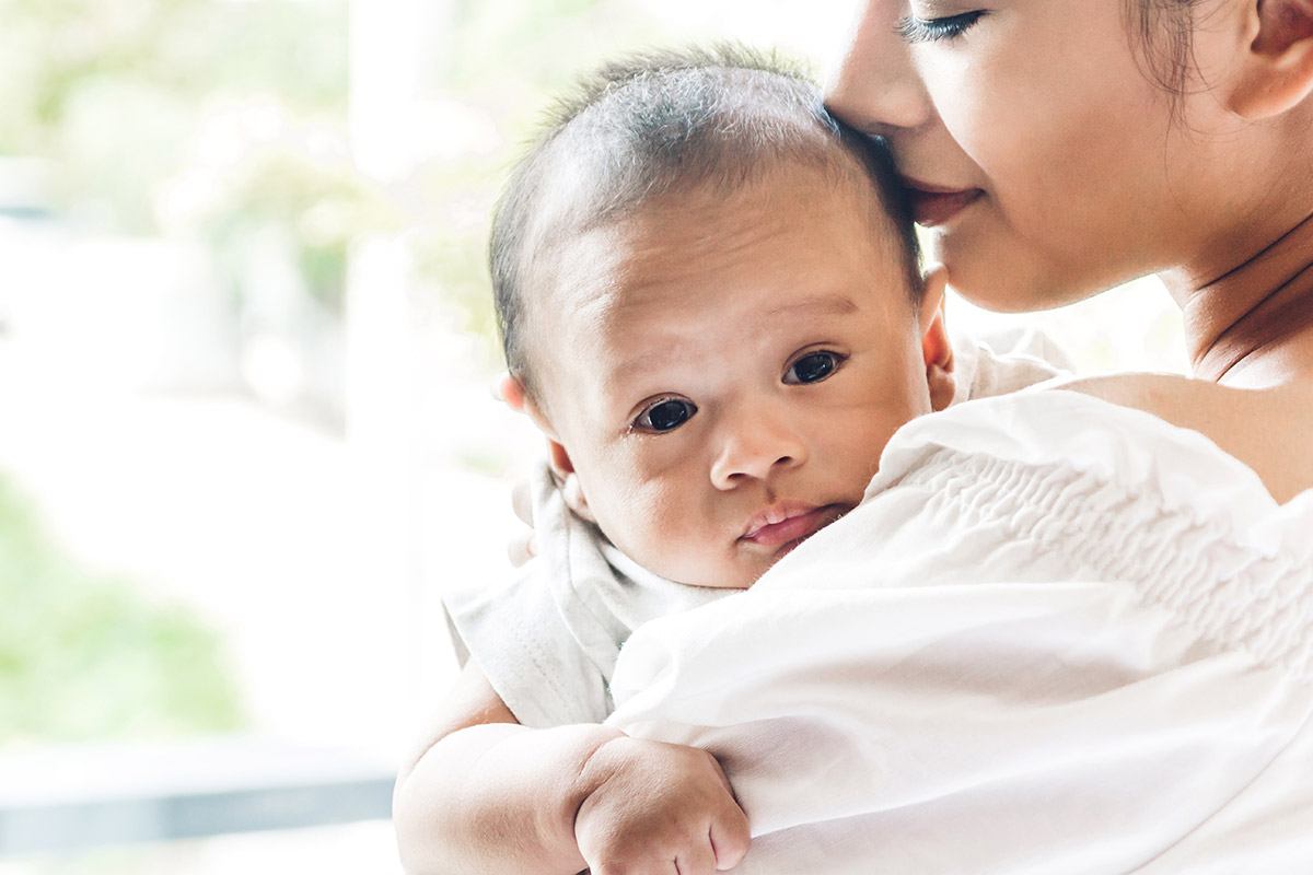 mother holding an infant
